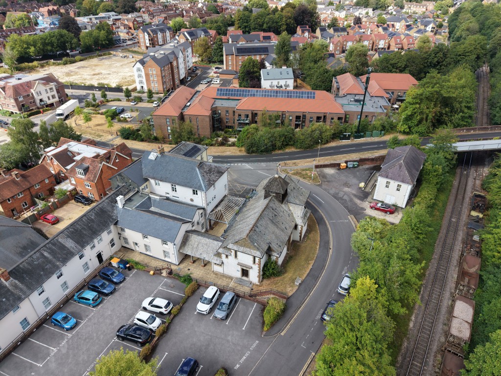 Lot: 6 - FREEHOLD TOWN CENTRE FORMER CHAPEL ARRANGED AS DANCE STUDIO AND EVENTS VENUE WITH A CAR PARK - Raised View of the Chapel and Car Park